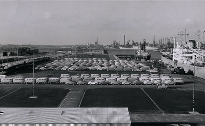 Historical aerial photo of VW automobile transshipment area in the industrial port of Bremen, many cars and a ship can be seen.