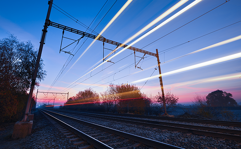 Intermodal transport: railway tracks in the sunset with dynamic lines Intermodal transport: railway tracks in the sunset with dynamic lines